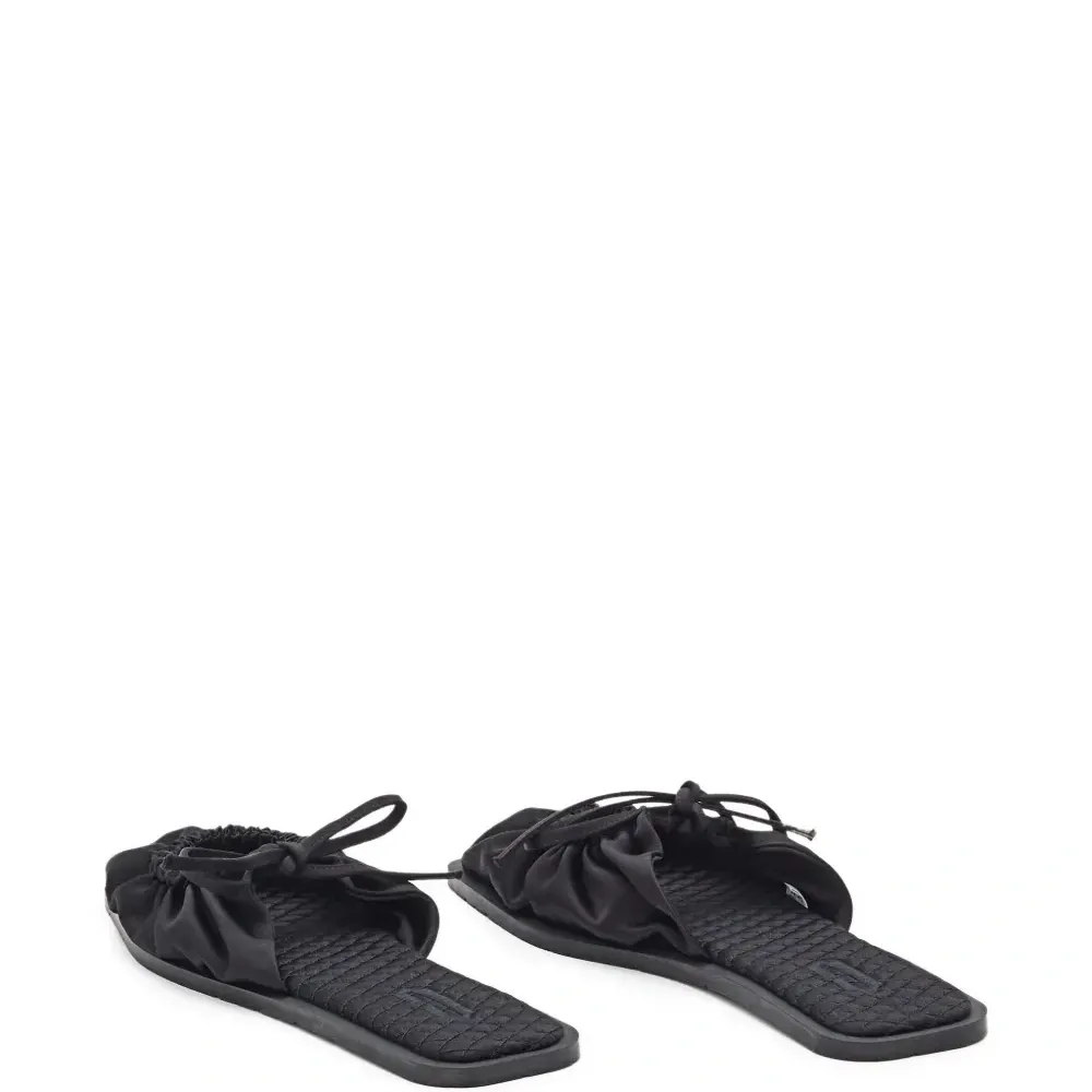 Мюли на плоской подошве с бантом