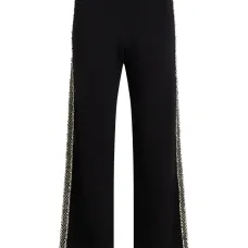 Трикотажные брюки со вставками из букле
