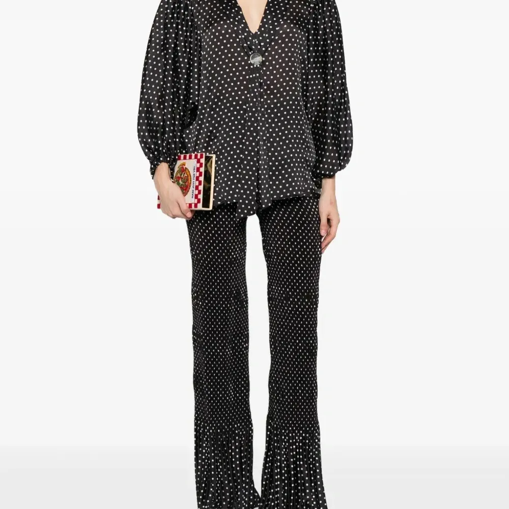 Брюки в горох со складками