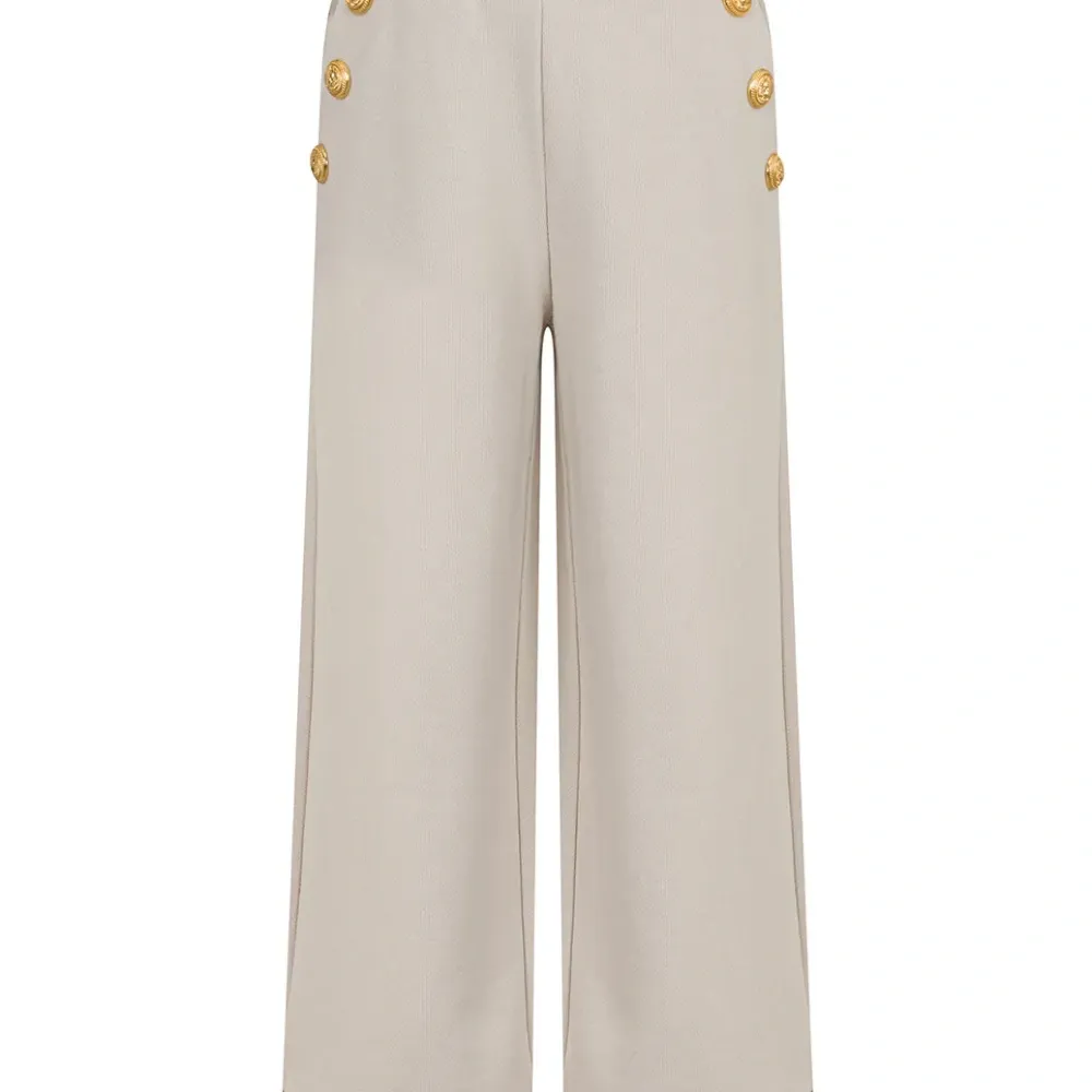 Брюки с манжетами на пуговицах