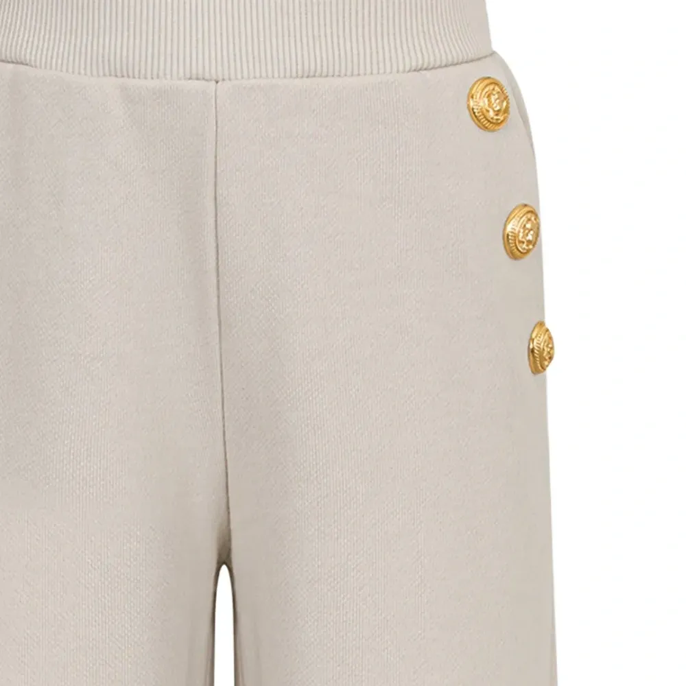 Брюки с манжетами на пуговицах