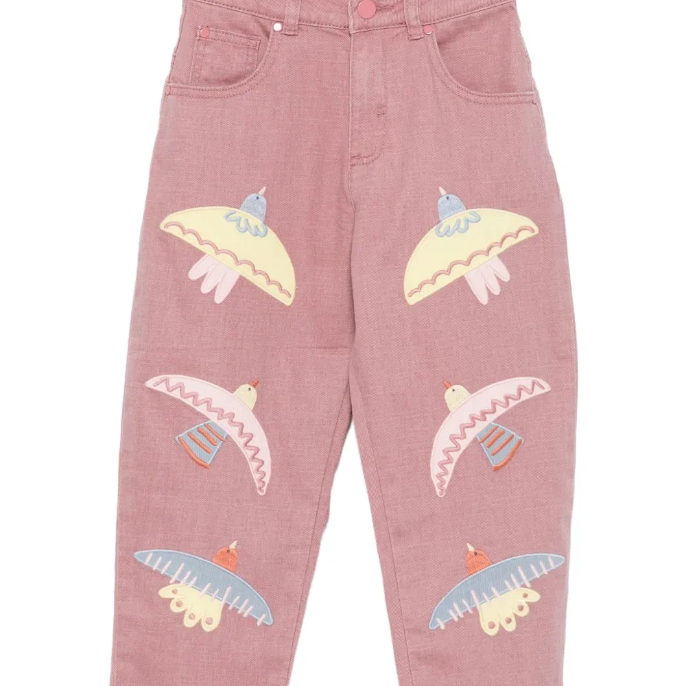 джинсы с вышивкой