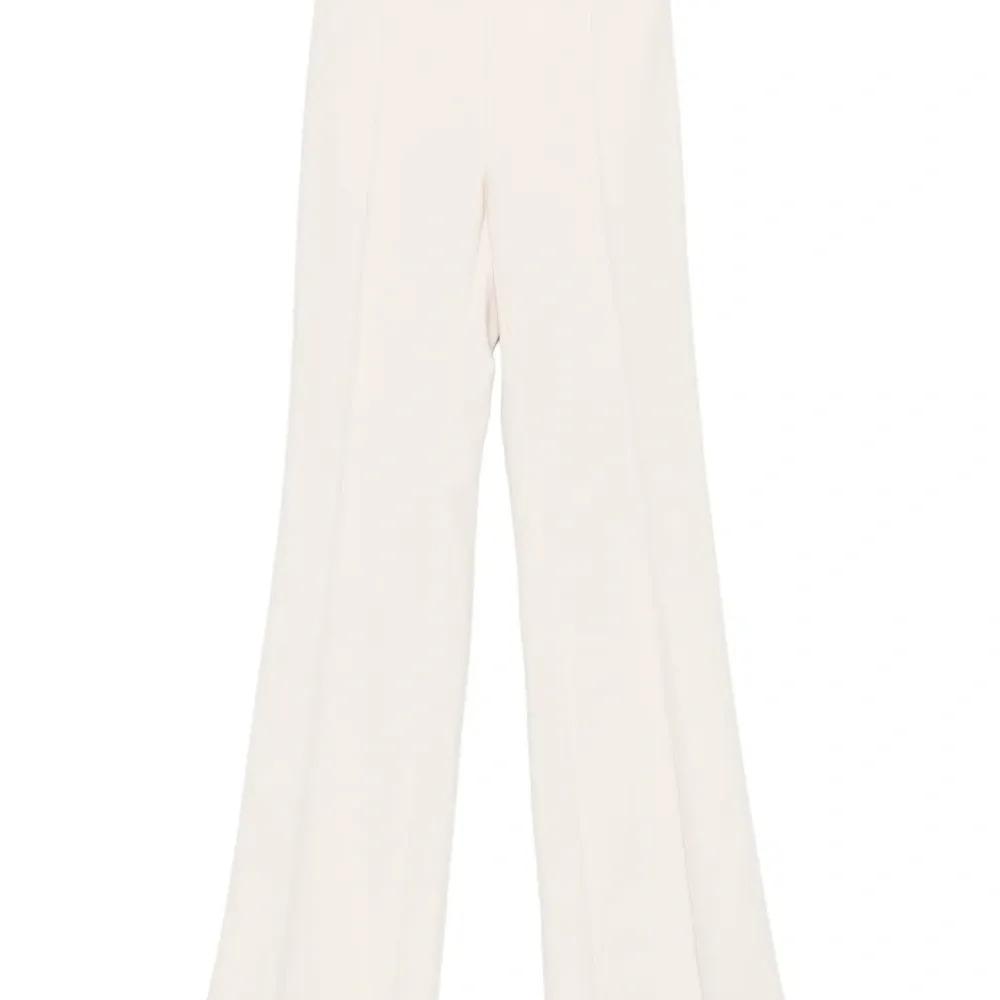 Расклешенные брюки с пуговицами