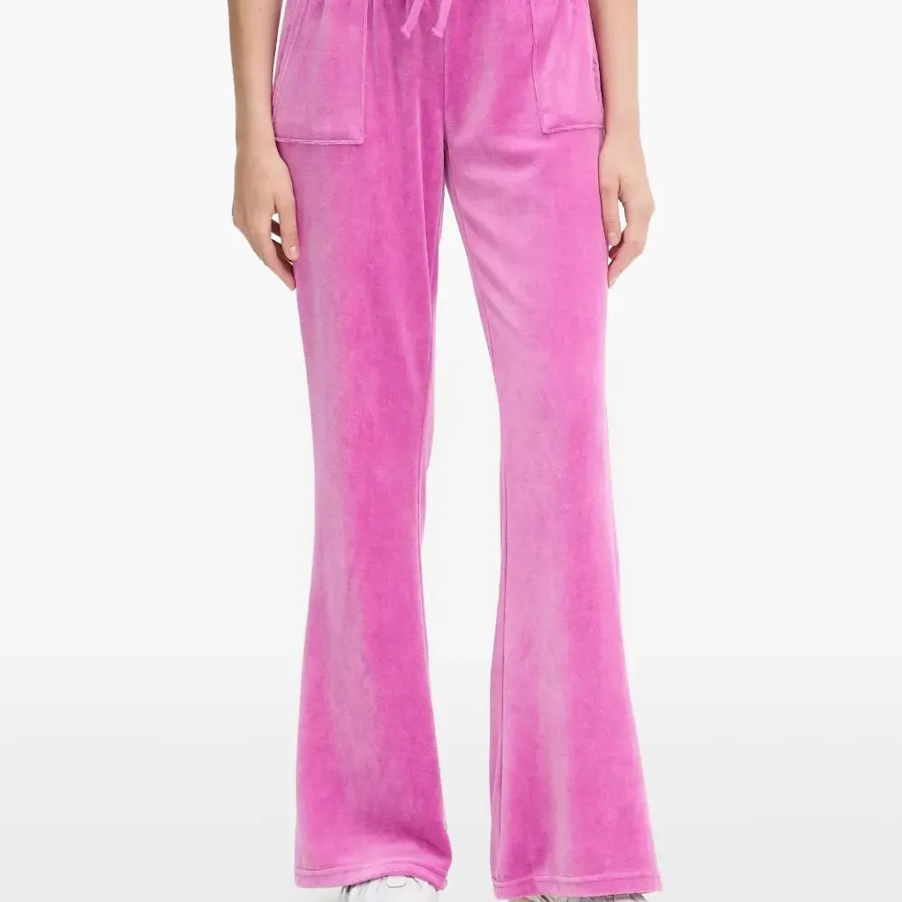 Брюки с накладными карманами и вышивкой