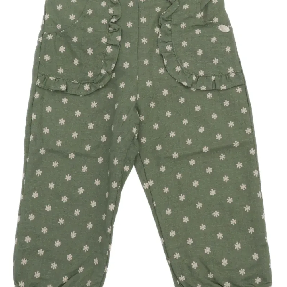 Брюки с оборками и цветочным принтом Брюки с оборками и цветочным принтом