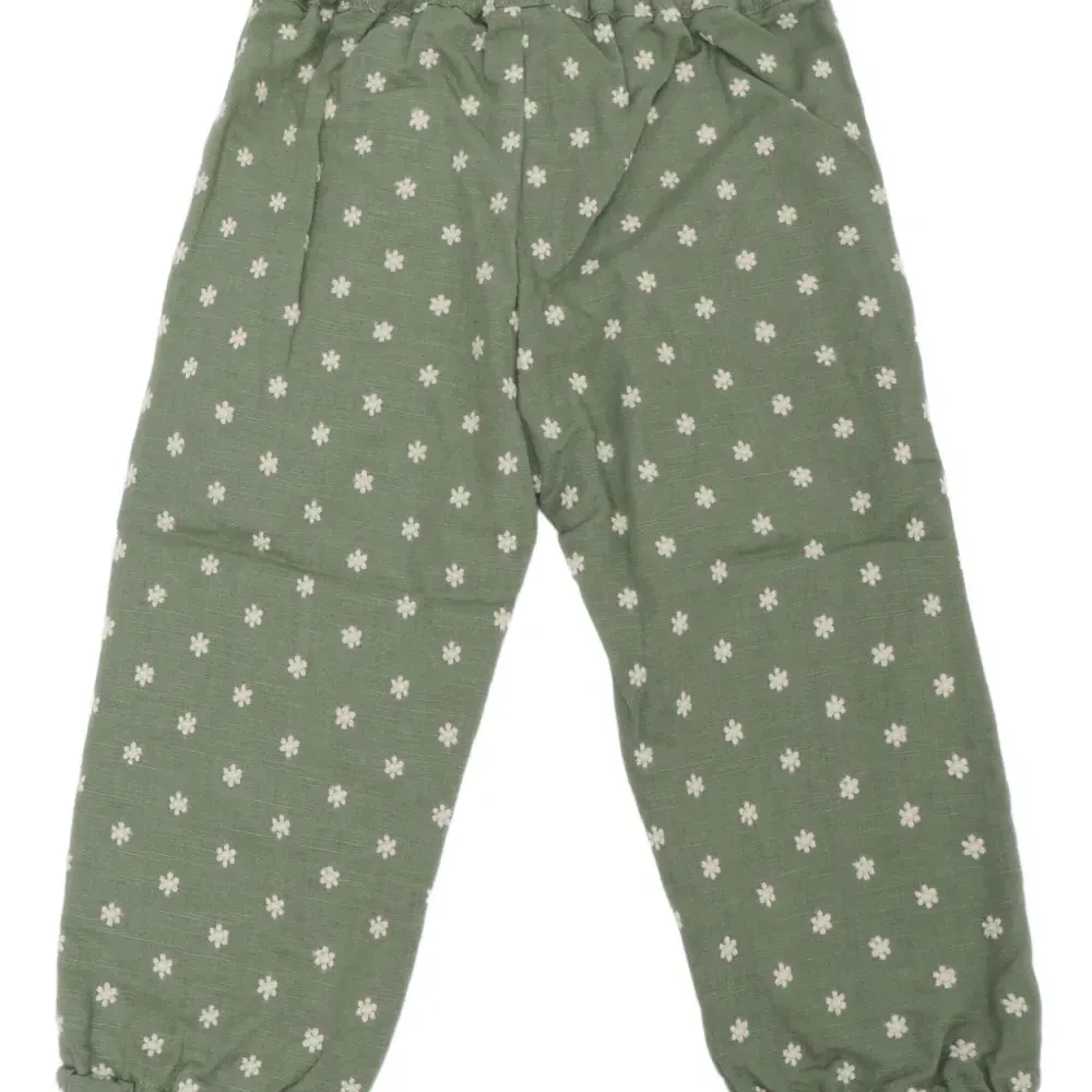 Брюки с оборками и цветочным принтом Брюки с оборками и цветочным принтом