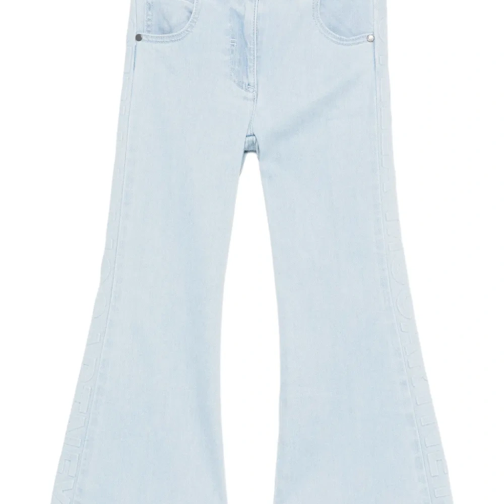 Расклешенные джинсы с вышивкой