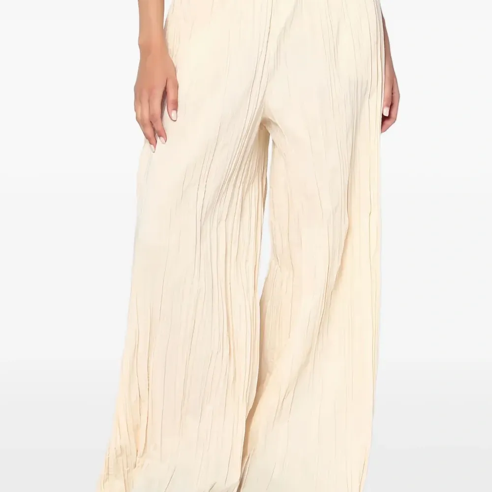 Плиссированные брюки