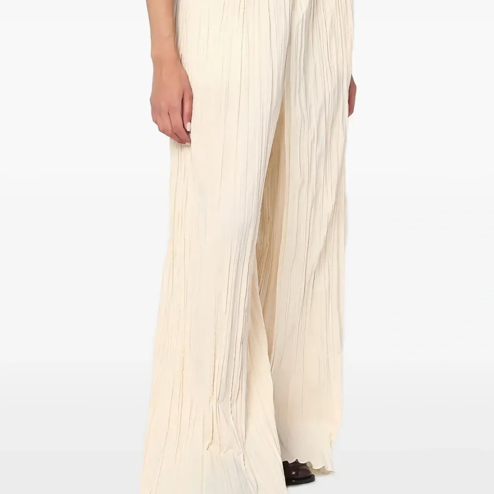 Плиссированные брюки