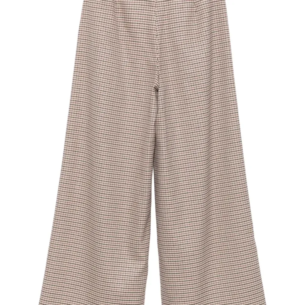 Брюки в ломаную клетку