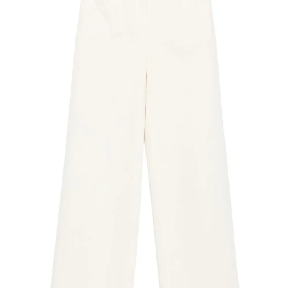 Расклешенные брюки с бахромой