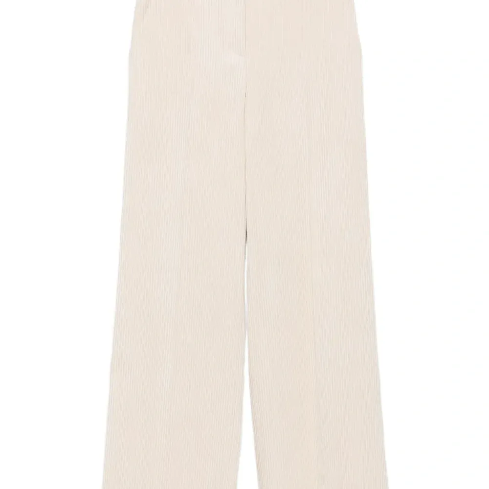 Брюки в рубчик с карманами