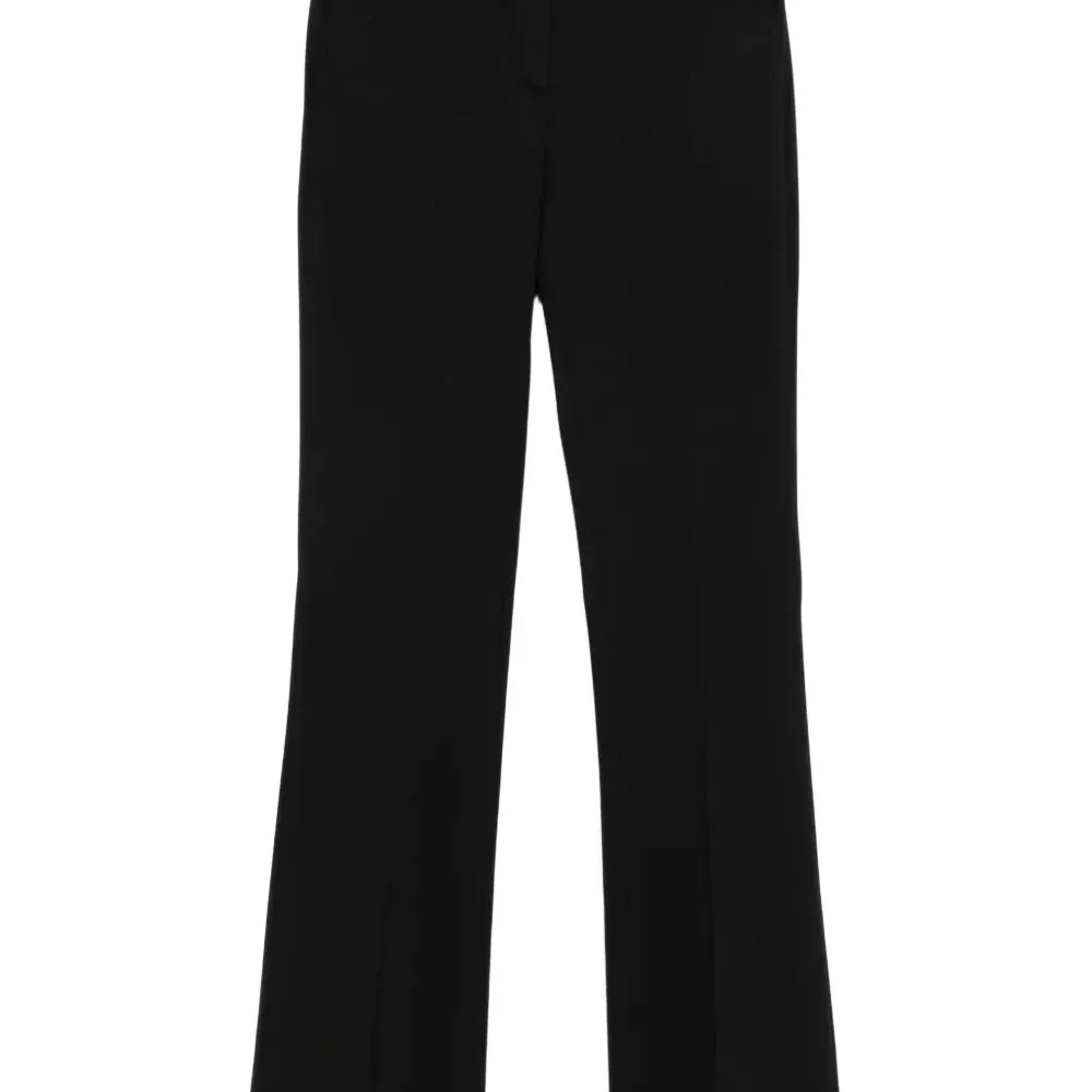 Расклешенные брюки с карманами