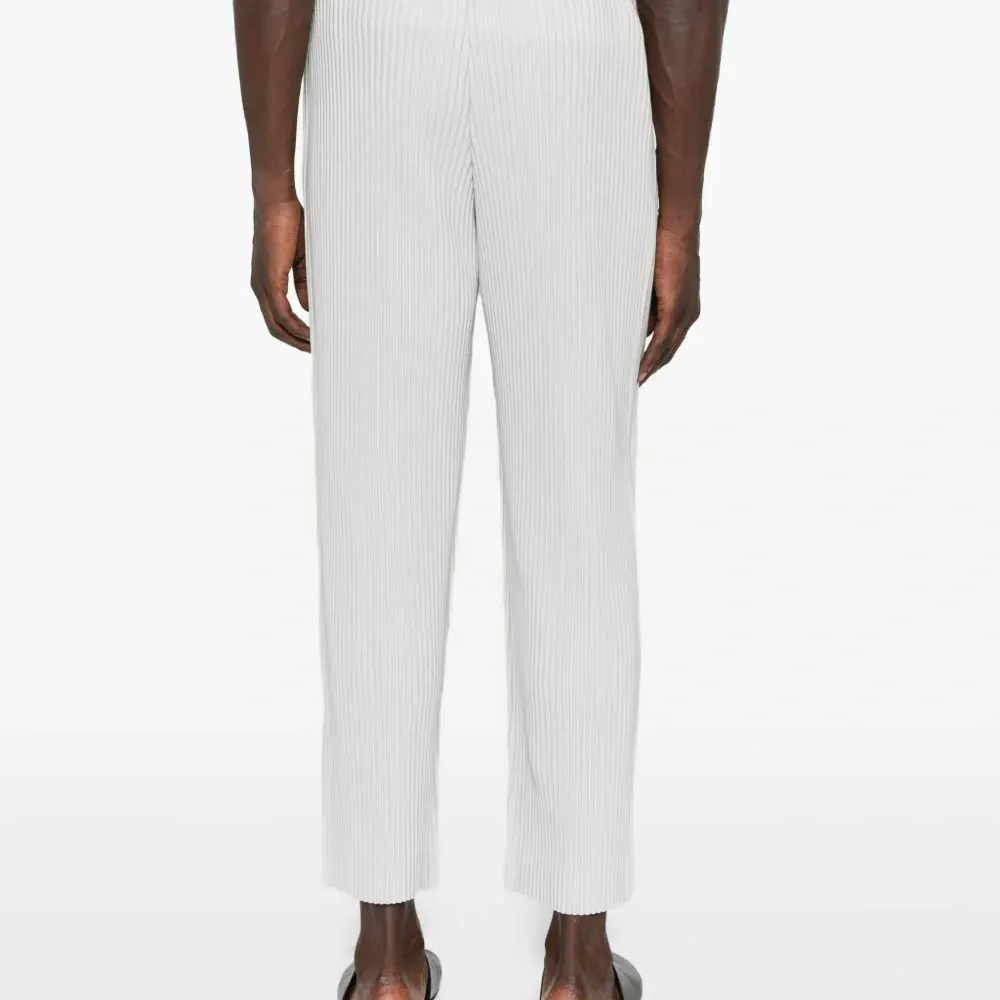 Плиссированные брюки Плиссированные брюки