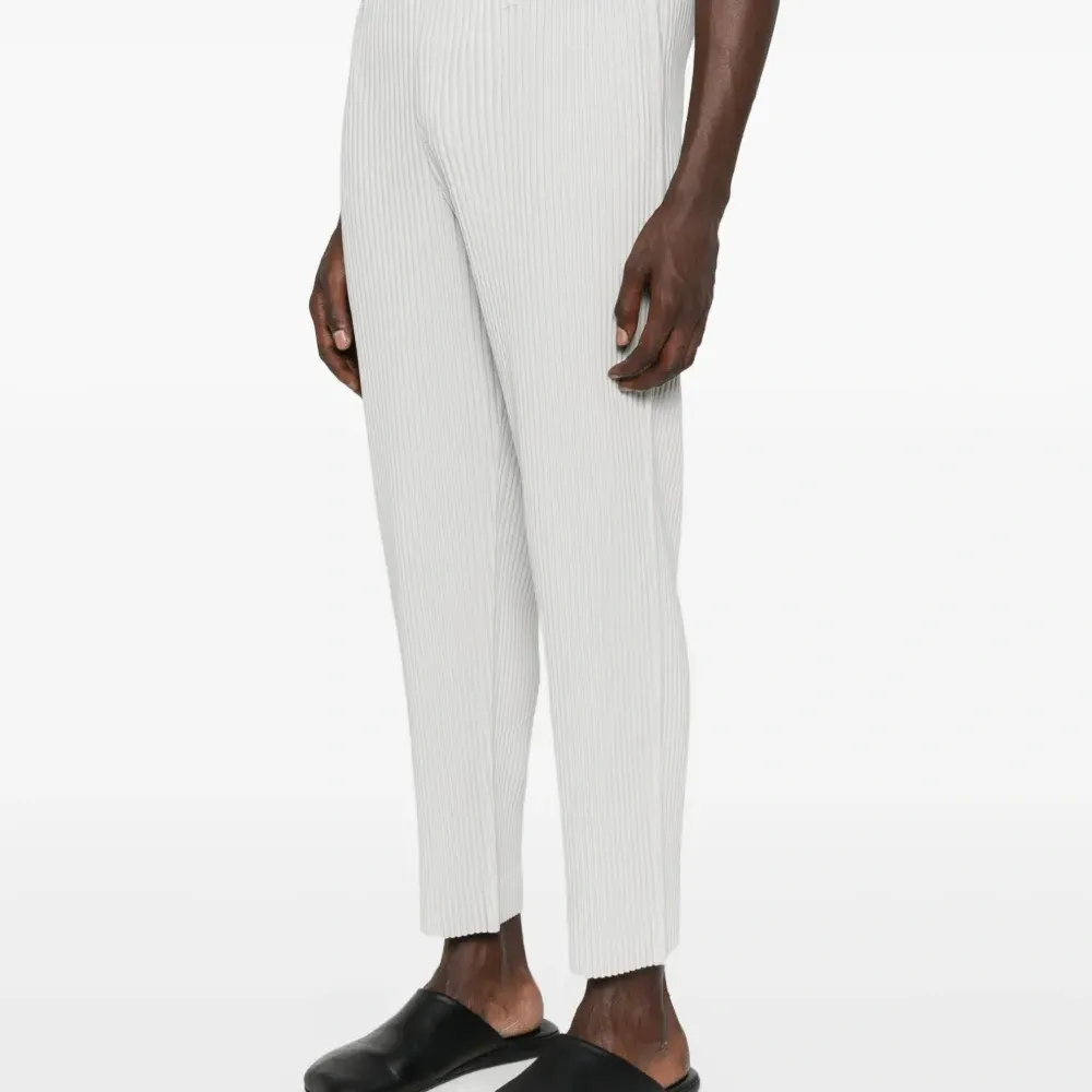 Плиссированные брюки Плиссированные брюки