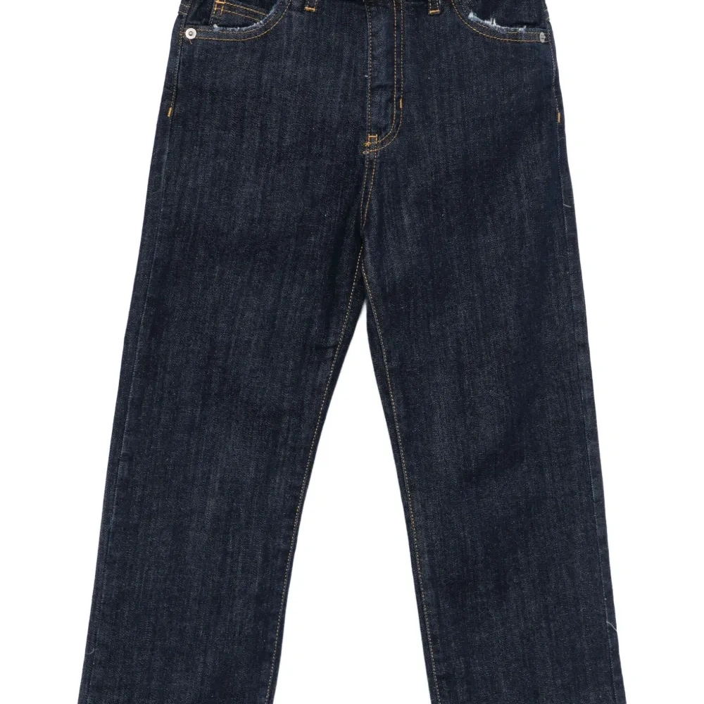 Джинсы с эффектом потертости