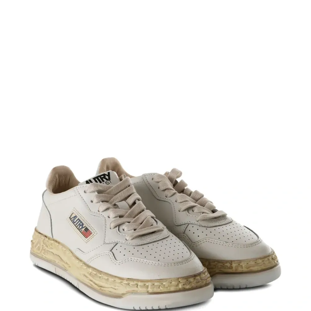 Кожаные перфорированные кеды X Autry Кожаные перфорированные кеды X Autry