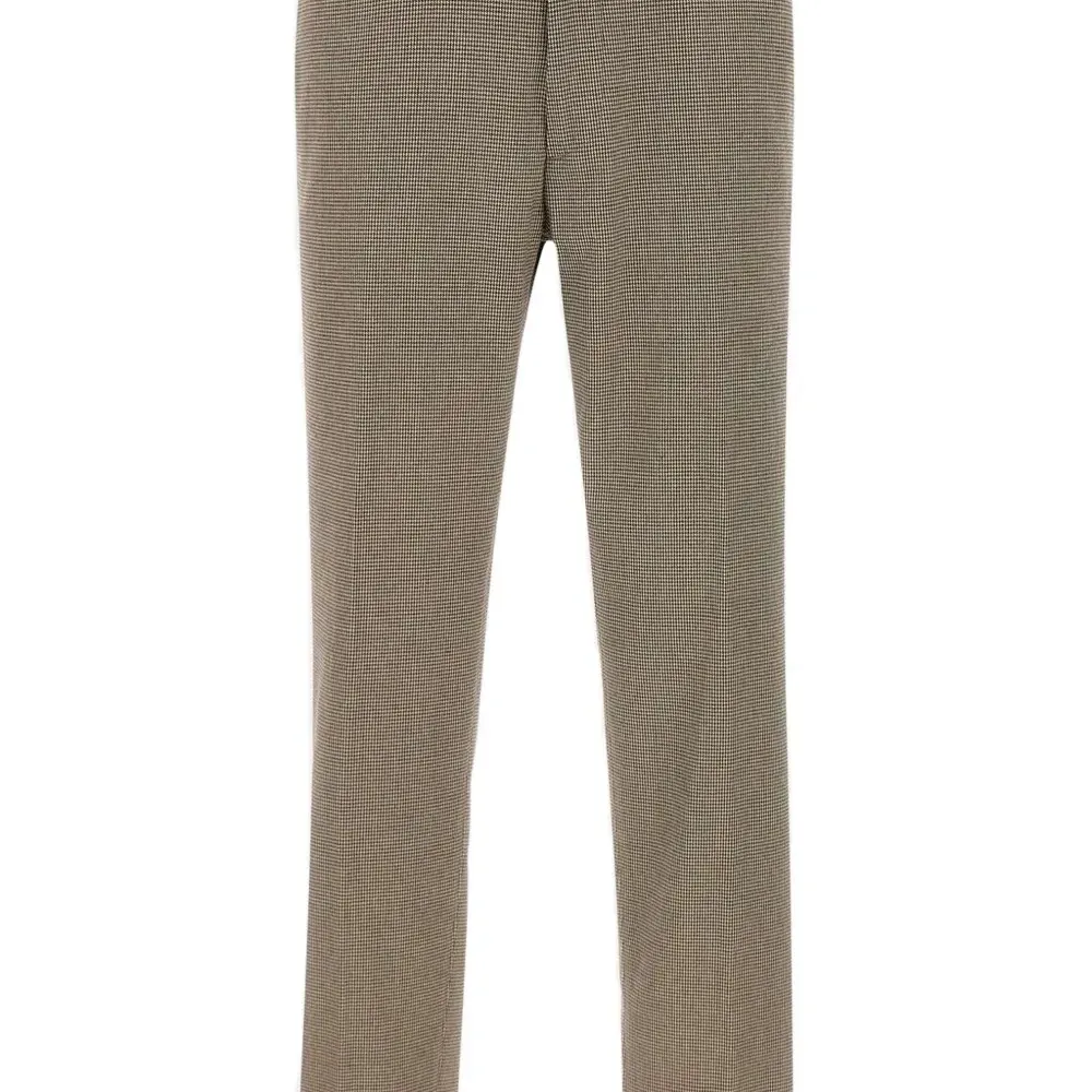 Брюки в ломаную клетку