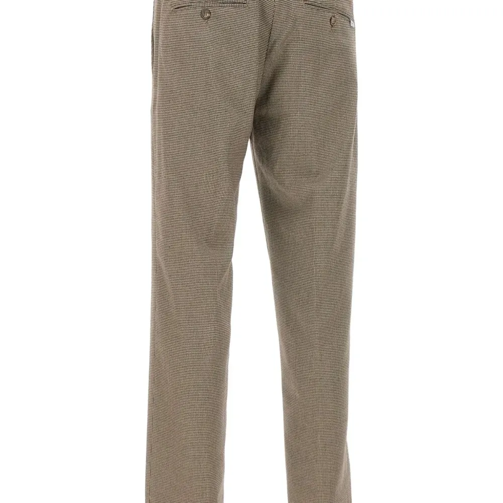 Брюки в ломаную клетку