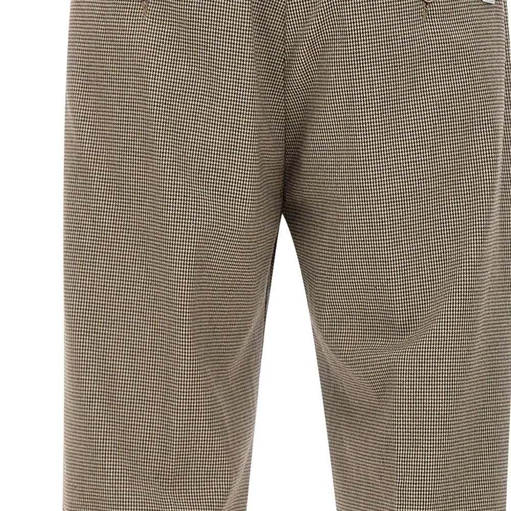 Брюки в ломаную клетку