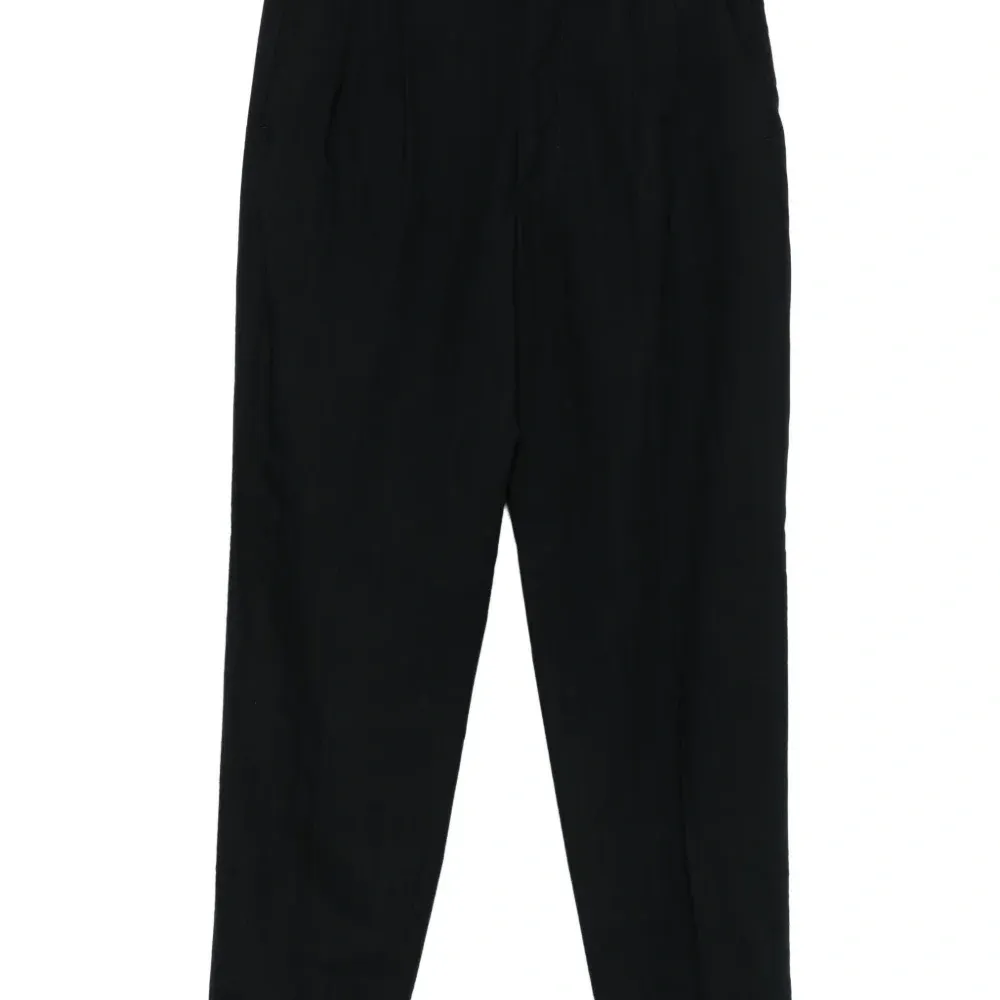 Брюки с защипами и подворотами