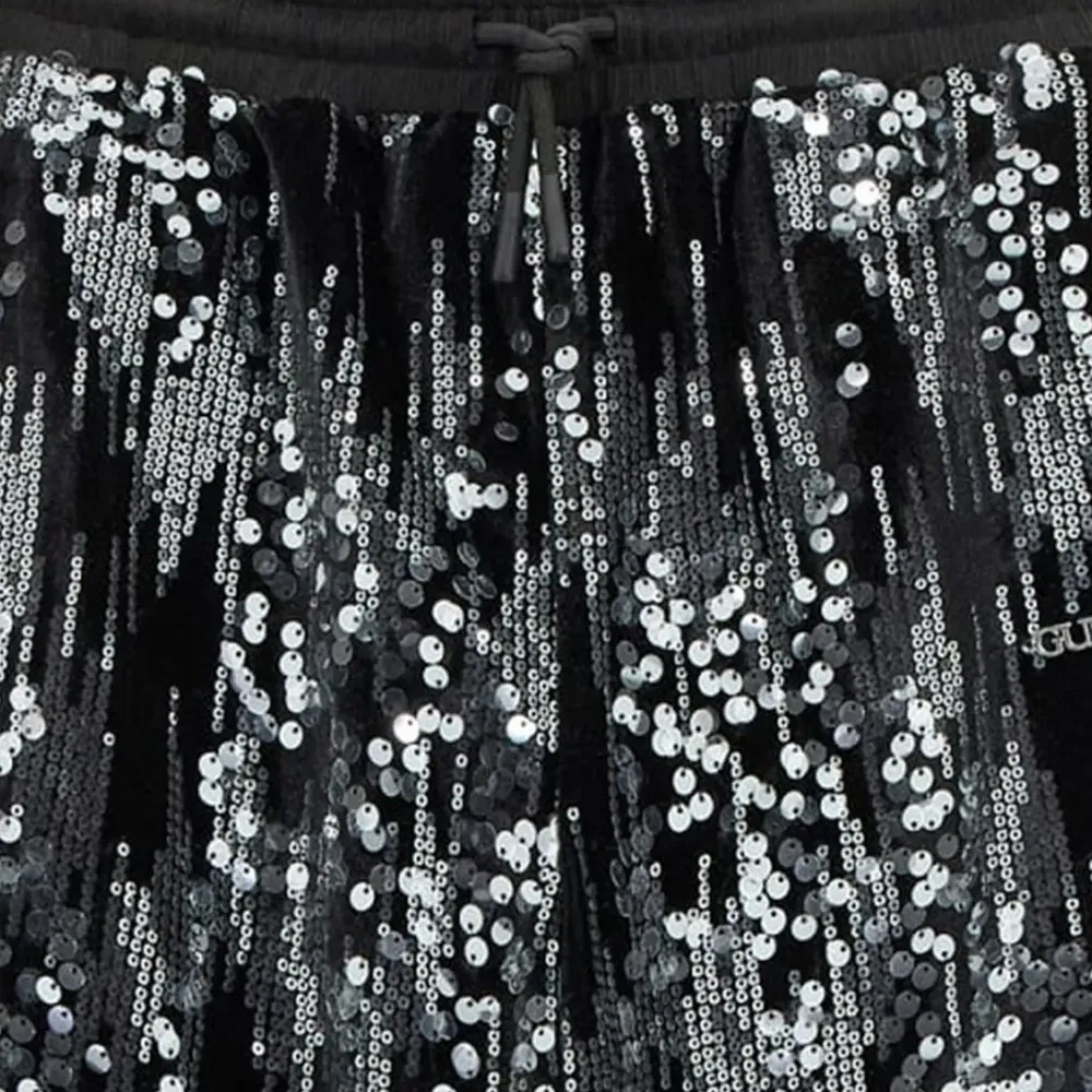 Вельветовые брюки, украшенные пайетками