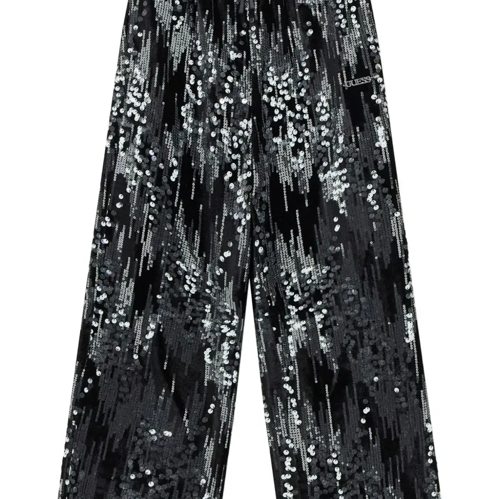 Вельветовые брюки, украшенные пайетками