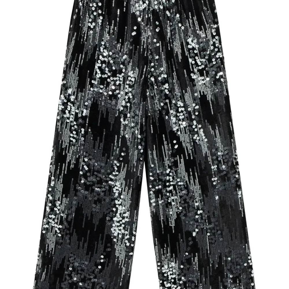 Вельветовые брюки, украшенные пайетками