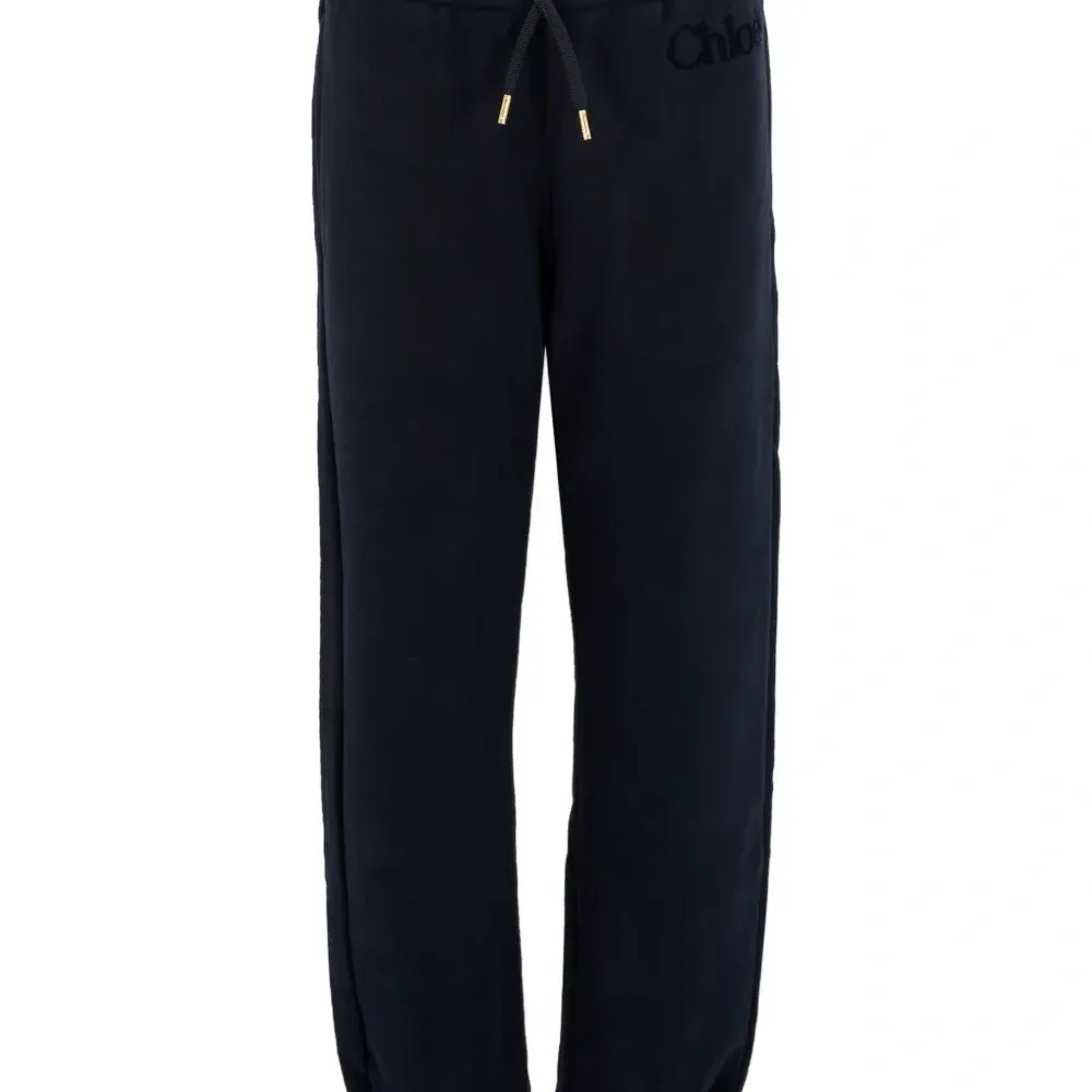 Брюки с манжетами и вышитым логотипом