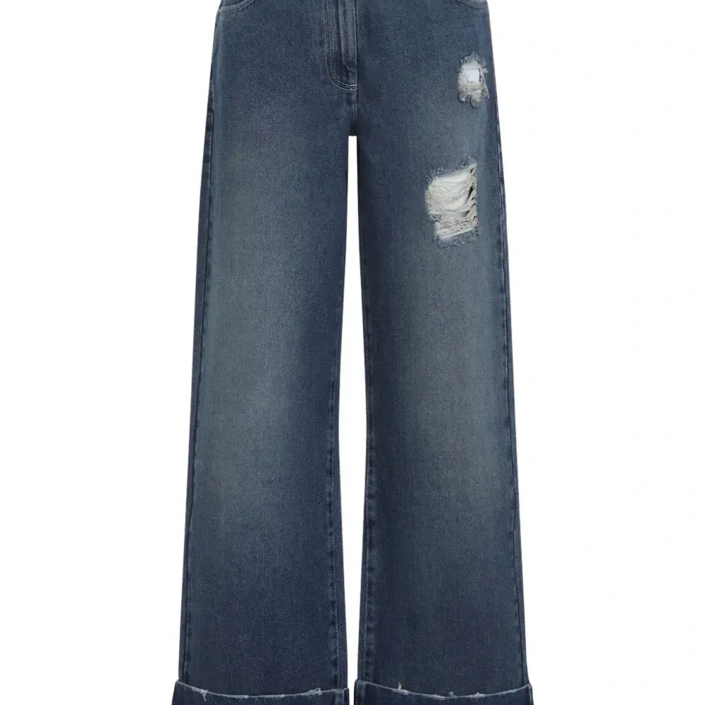 Джинсы с эффектом потертости