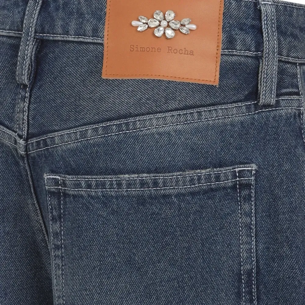 Джинсы с эффектом потертости