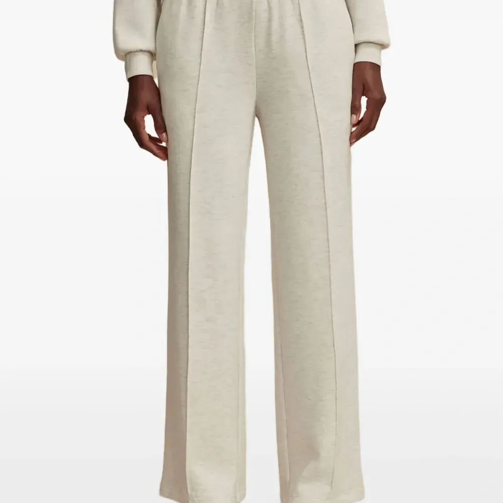 Брюки с широкими штанинами и эластичным поясом Брюки с широкими штанинами и эластичным поясом