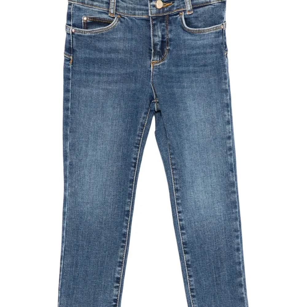 Джинсы с пятью карманами Джинсы с пятью карманами