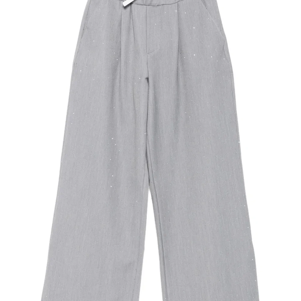 Плиссированные блестящие брюки