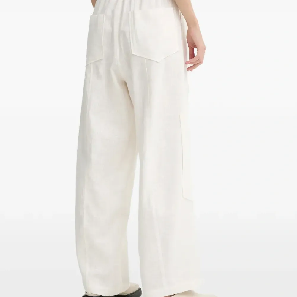 Льняные брюки с карманами