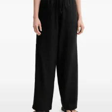 Льняные брюки с завязками и карманами