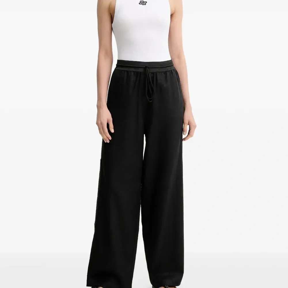 Льняные брюки с завязками и карманами