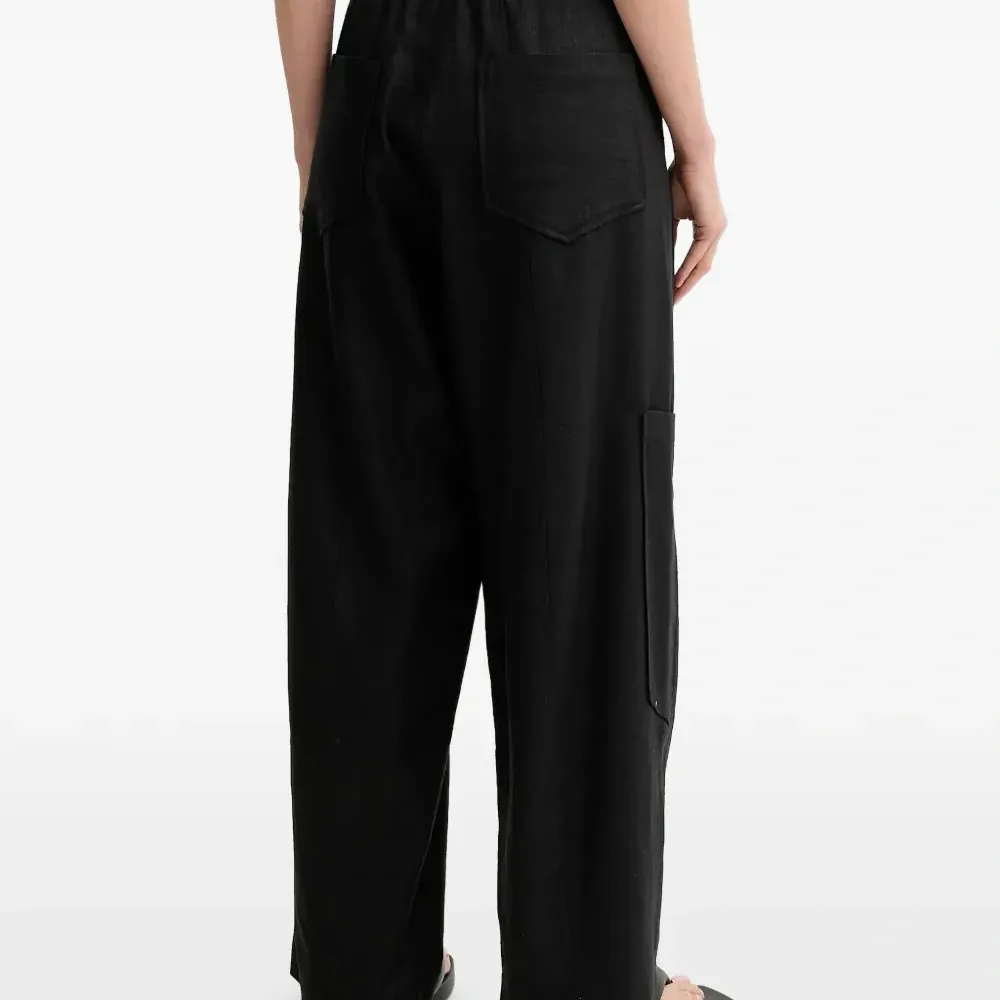 Льняные брюки с завязками и карманами