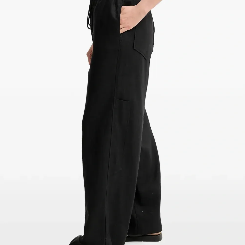 Льняные брюки с завязками и карманами