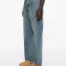 Джинсы с широкими скрученными штанинами