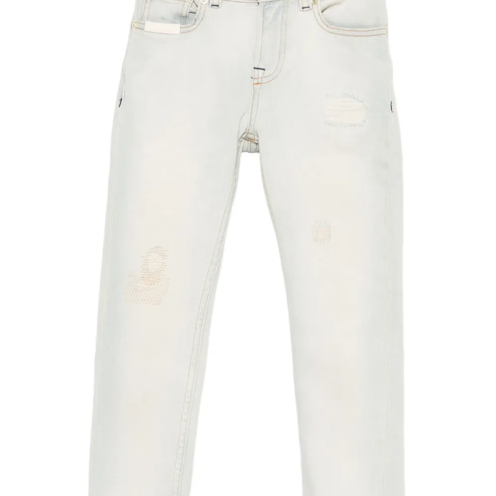 Джинсы с эффектом потертости