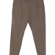 Брюки с защипами и манжетами