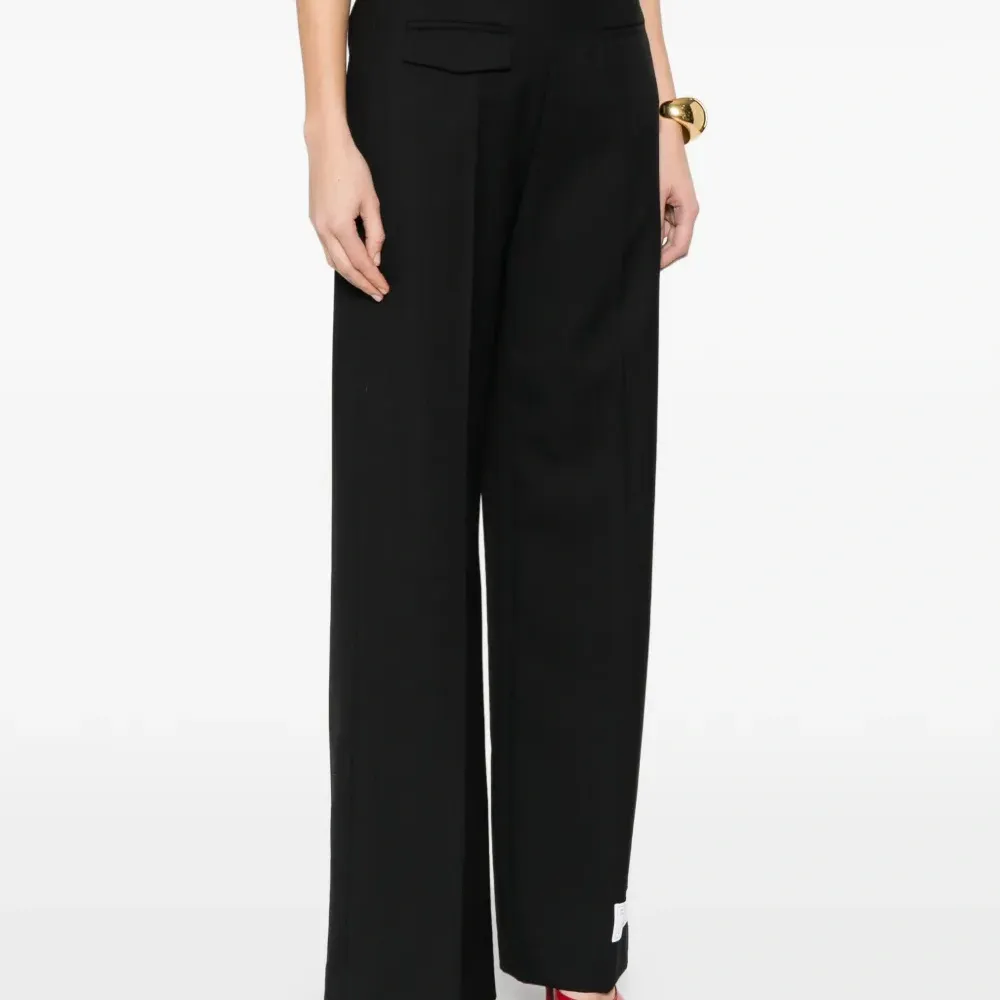 Брюки с прорезными карманами Брюки с прорезными карманами