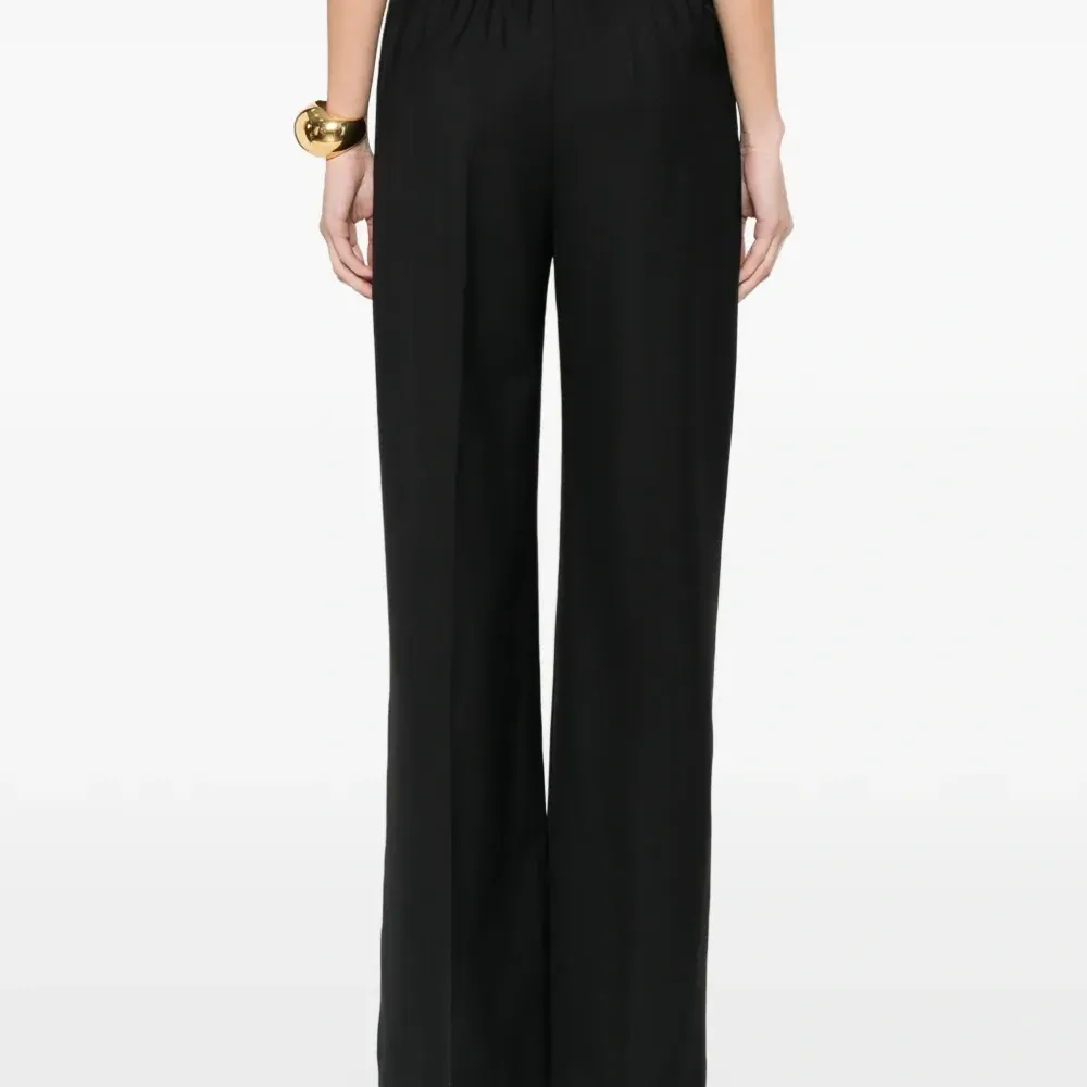 Брюки с прорезными карманами Брюки с прорезными карманами