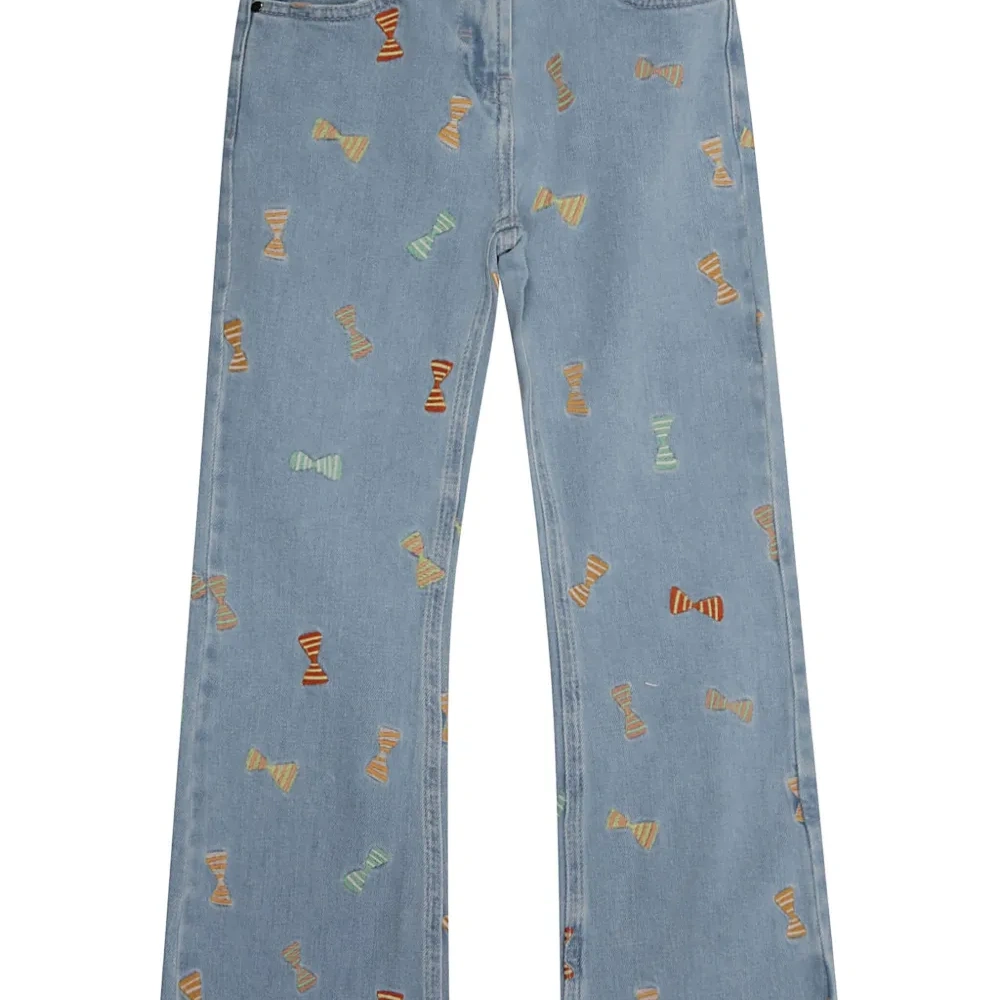 Расклешенные джинсы с бантом