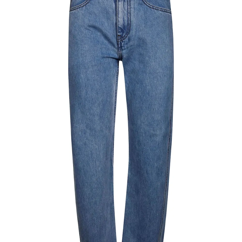 Джинсы с перекрученным кроем