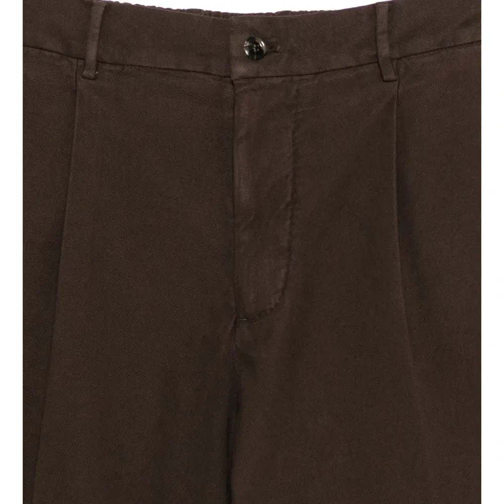 Брюки с защипами