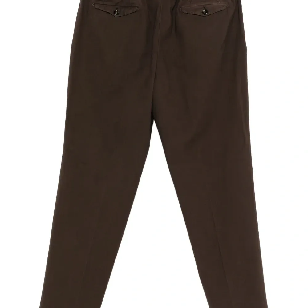 Брюки с защипами