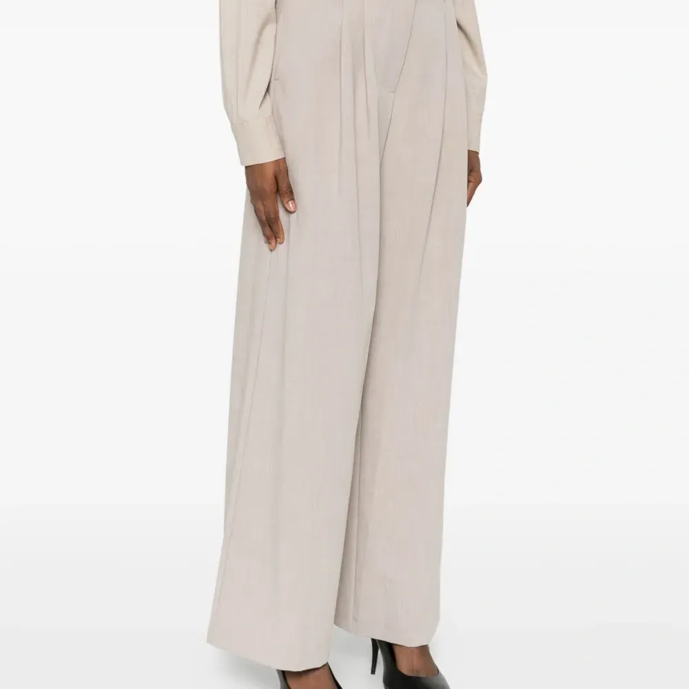 Плиссированные брюки Плиссированные брюки