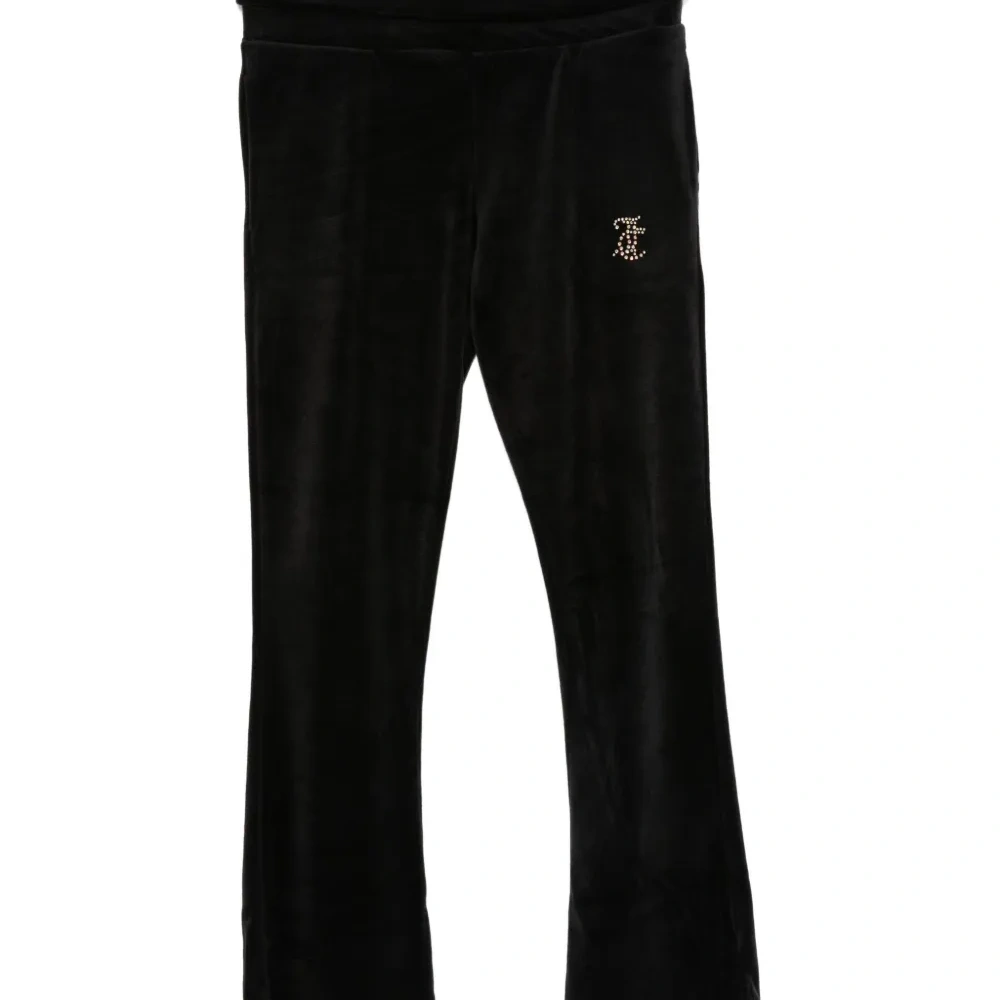 Велюровые брюки, украшенные стразами